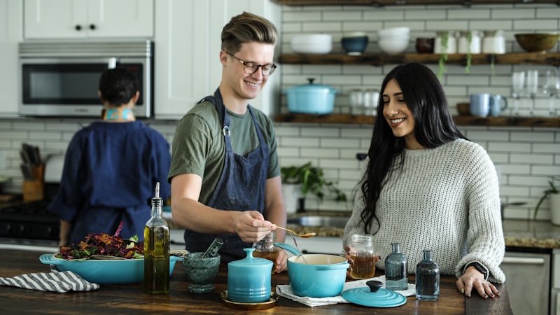 Family cooking together with colorful ingredients from around the world